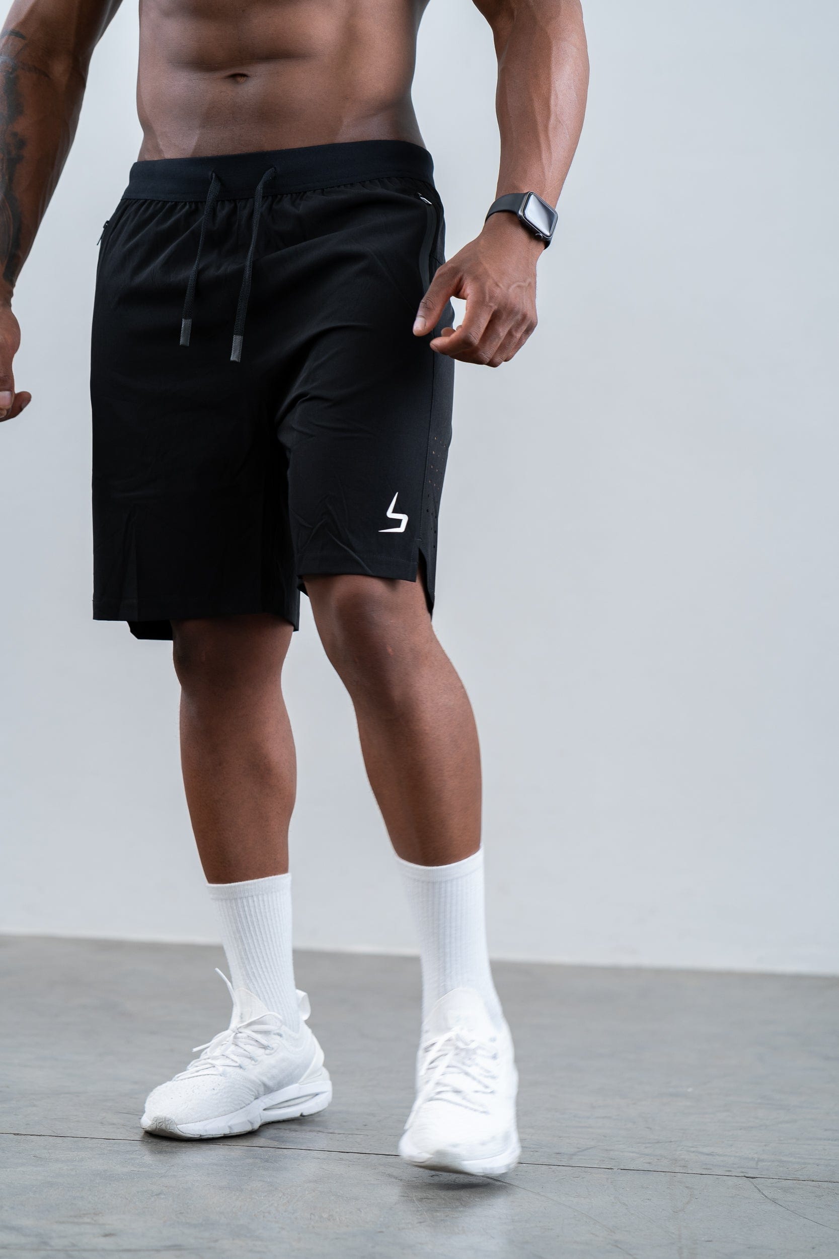 man wearing botthms black training sport short